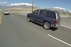 Motorcyclist Rescues Coffee Cup from Rear Bumper of SUV